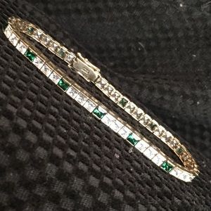 CZ tennis bracelet with green accent stones